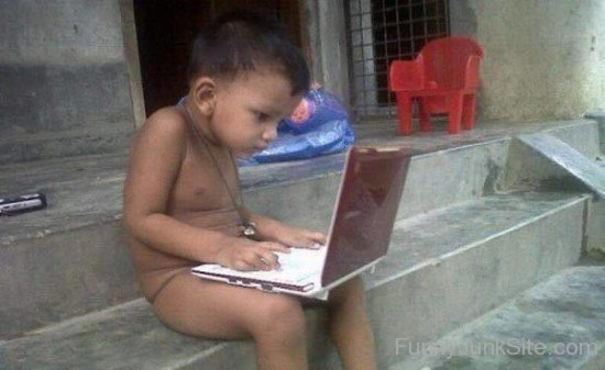 Funny Kid Using Laptop