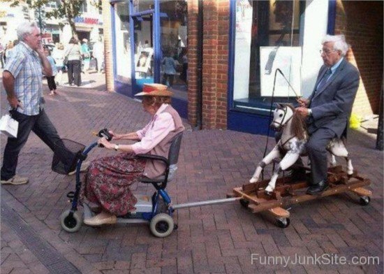 Funny Old Couple On Scooter