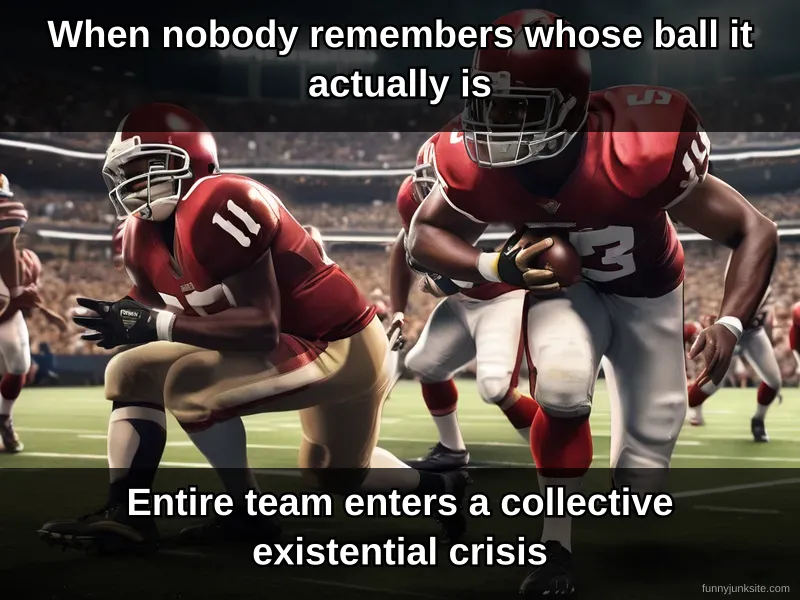 NFL players in full gear staring at dropped football with confused panic expressions on field during game